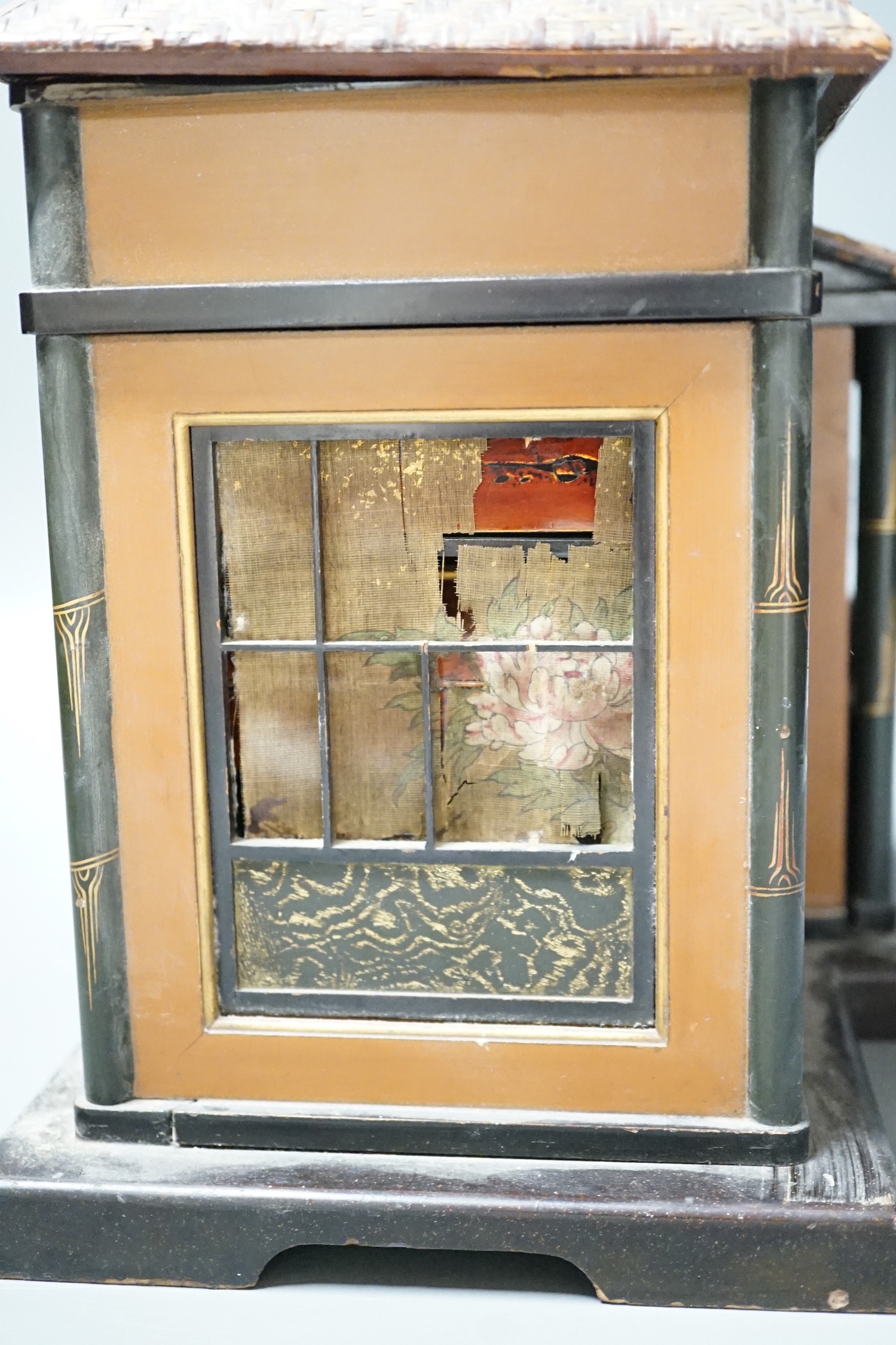 A Japanese lacquer 'house' with pitched wicker roof and opening side and front sections revealing internal shelves and six lacquer boxes and a small glass painted panel, ‘house’ height 28.5 cms high